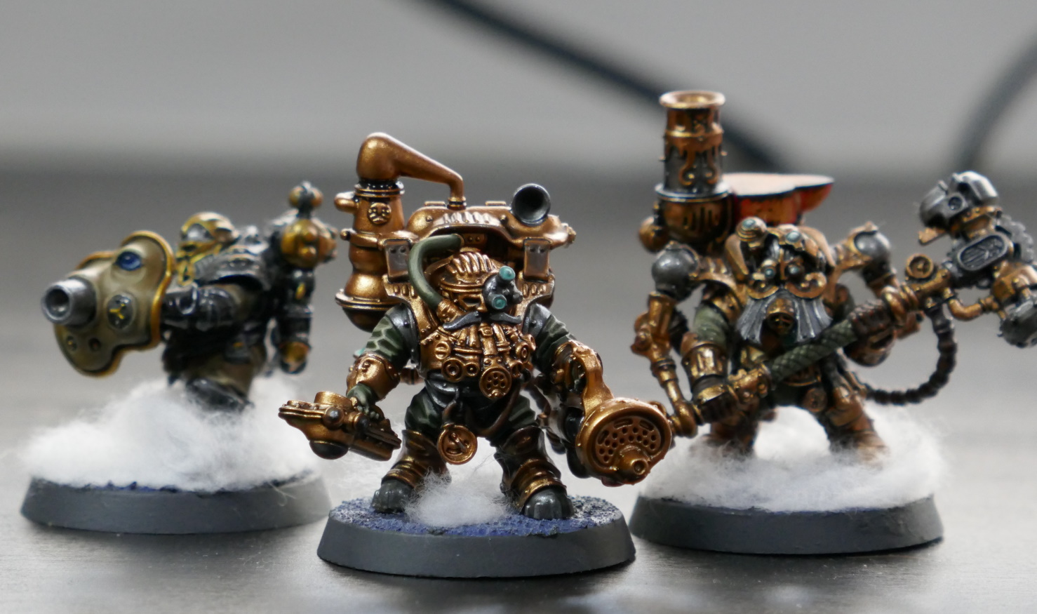 Three Kharadron Overlords miniatures, painted bronze